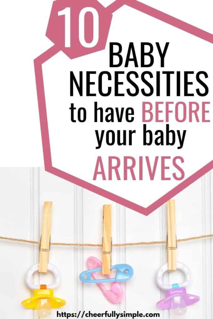 10 baby necessities to have before your baby arrives Pinterest pin with a picture of baby pacifiers hanging from a clothesline