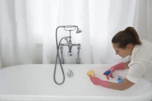 mother cleaning bathtub