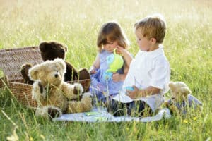 picture of a boy and girl having a summer picnic