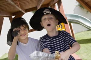 picture of 2 boys playing pirates outside
