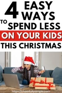 4 easy ways to spend less on your kids this Christmas Pinterest pin with a picture of a woman holding a credit card looking at her computer with a shocked expression on her face