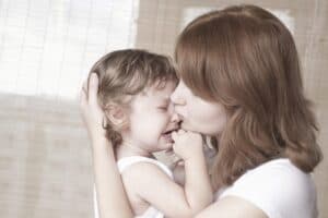 mother comforting toddler