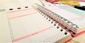 picture of the 2023 weekly planner laid out on a desk