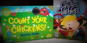 picture of two board games for kids; count your chickens and chutes and ladders