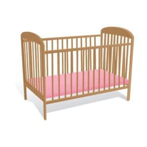 picture of a wooden baby crib with a pink mattress