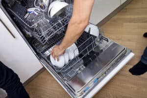emptying clean dishwasher