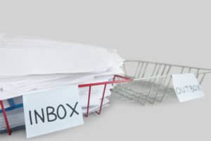 inbox of paper mail with no bills being paid