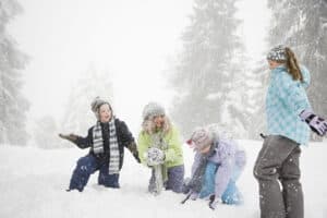 picture of a family playing together in the snow