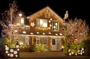 picture of a house with a lot of Christmas lights on the house and trees