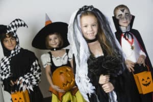 kids dressed in Halloween costumes for a costume contest