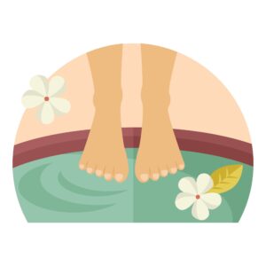 woman's feet soaking in tub of salt water