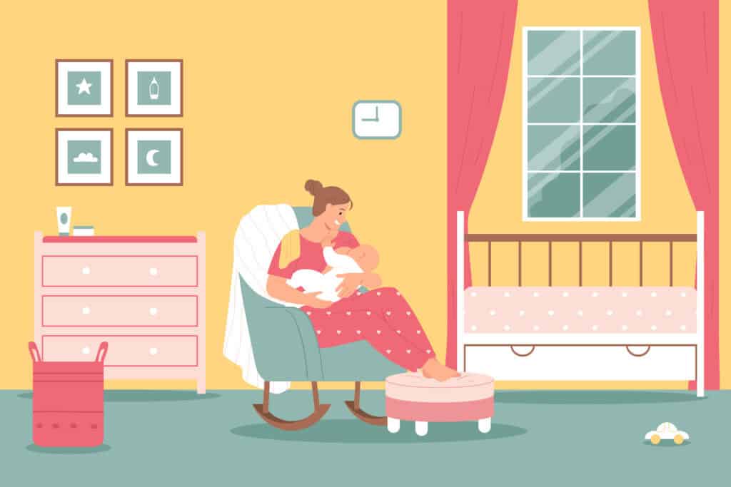 picture of a woman sitting in a small rocking chair in a nursery holding a her baby