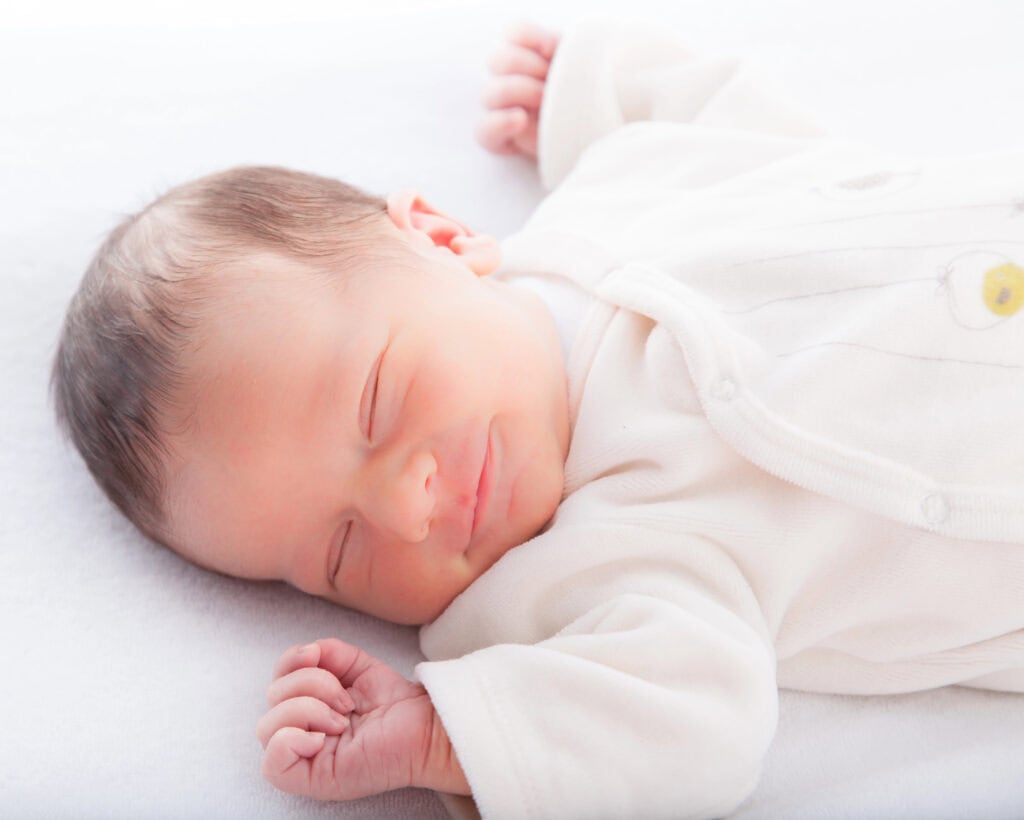 picture of a baby sleeping on a newborn sleeping schedule