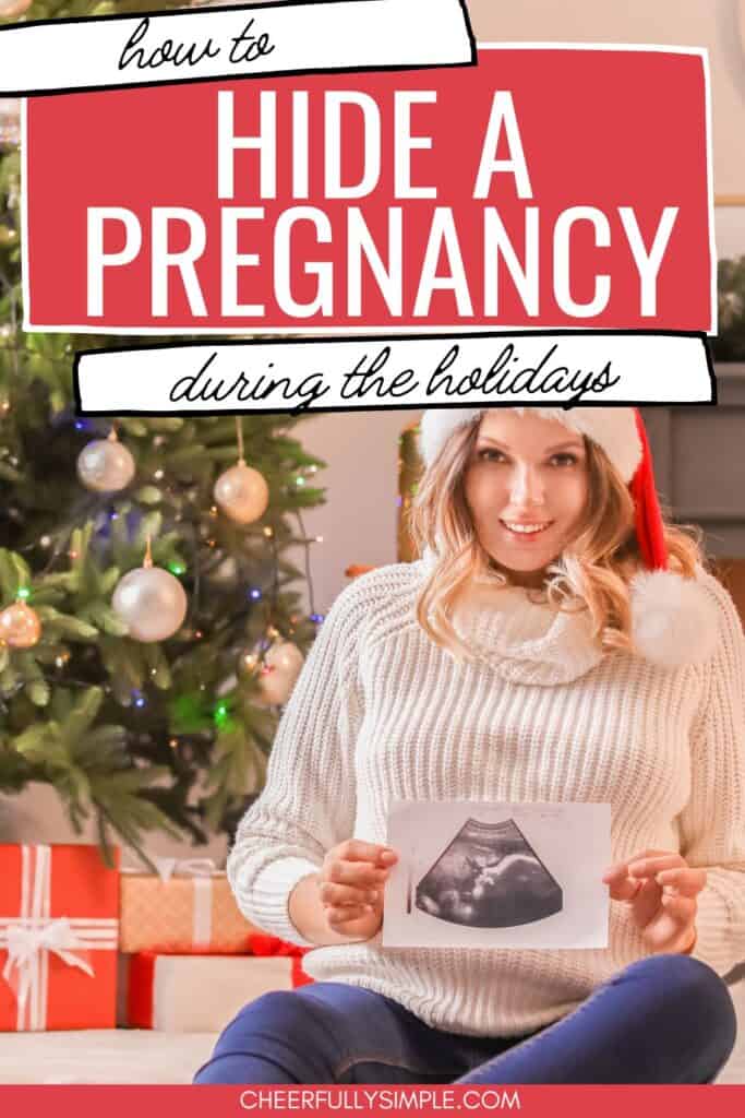 how to hide a pregnancy during the holidays pinterest pin with a woman wearing a Santa hat while pregnant and holding an ultrasound picture
