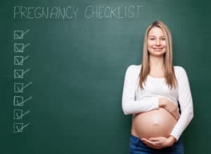 pregnancy checklist with a pregnant woman