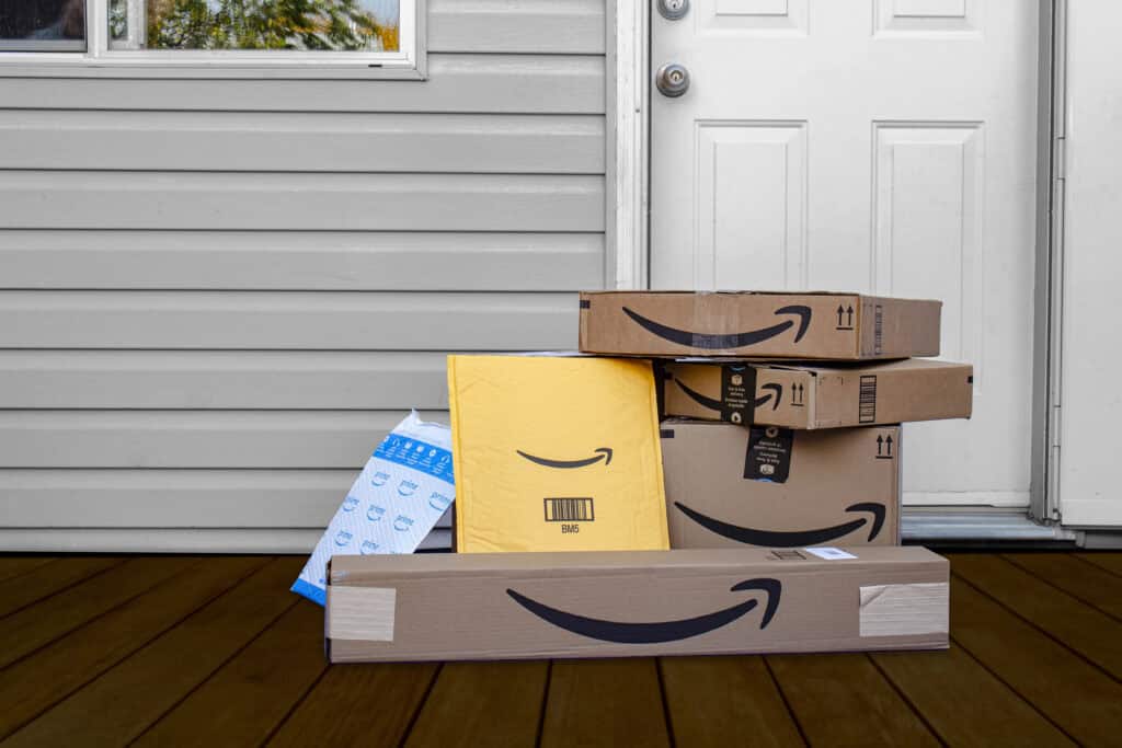 picture of Amazon shipping boxes on a doorstep