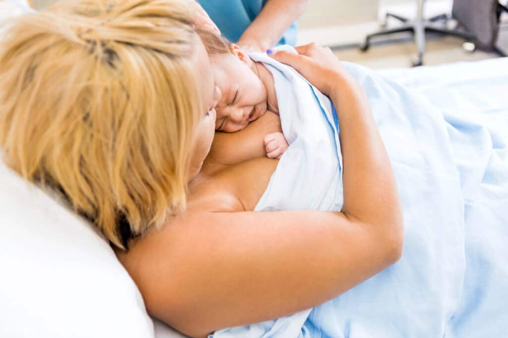 mother holding baby after a C-section