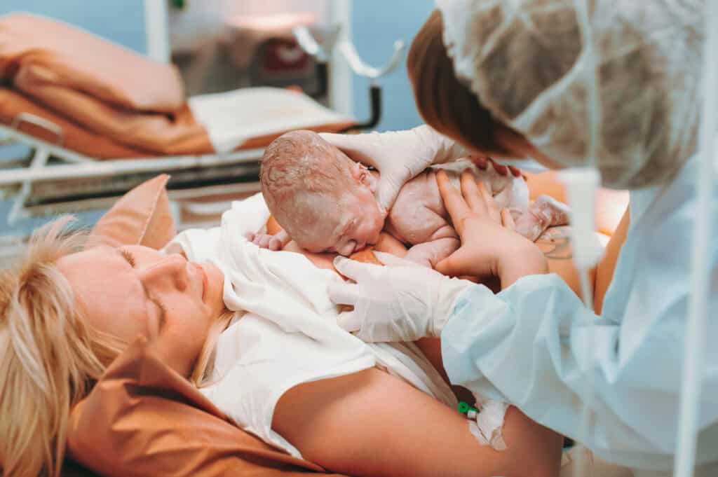 woman breastfeeding immediately after a C-section