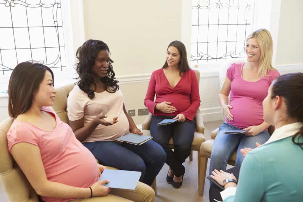 picture of a group of pregnant women sitting in a birthing class