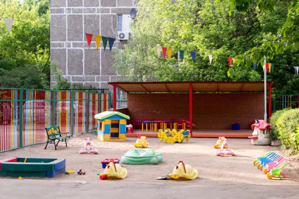 picture of children's toys outside on the ground