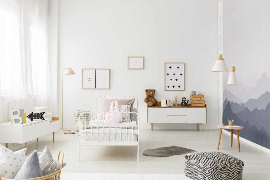 picture of a child's bedroom with furniture and toddler bed