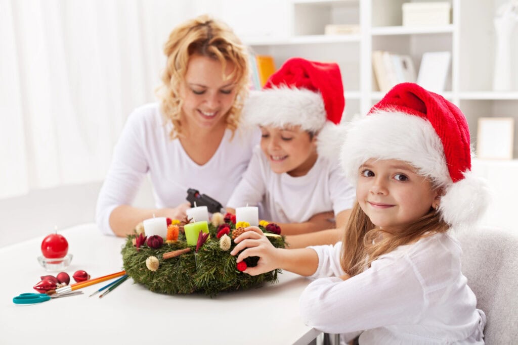 mother making an Advent wreath with her kids